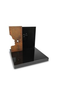 Monumento para urna Deixar Ir com silhueta e dente-de-leão em granito e aço Corten